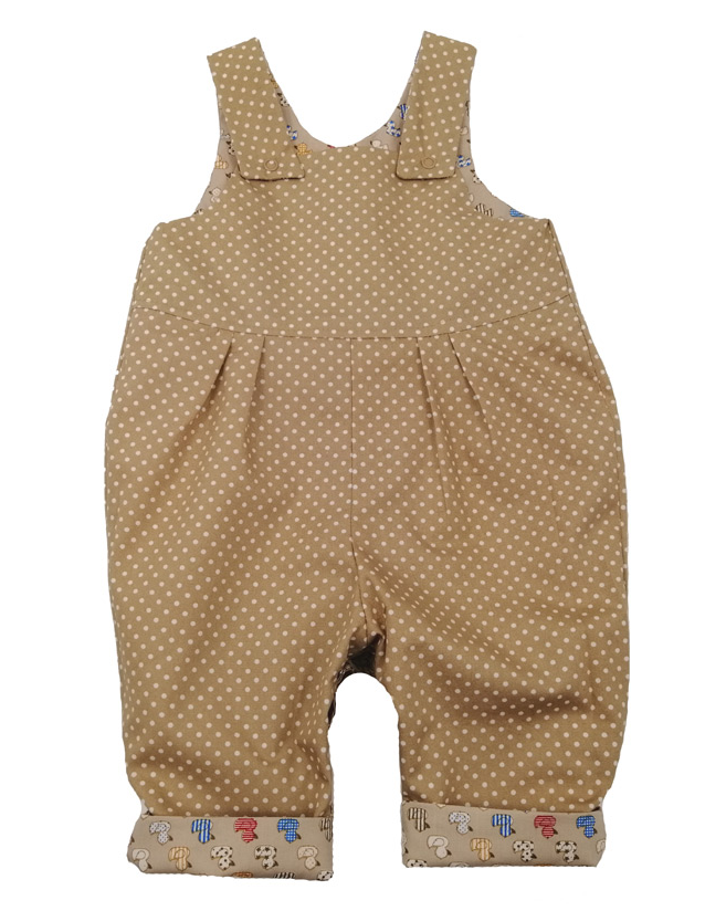 Ducks Reversible Dungarees by Seesaw, duck print side close-up, illustrated rubber ducks in red, blue, yellow and cream on sandy beige