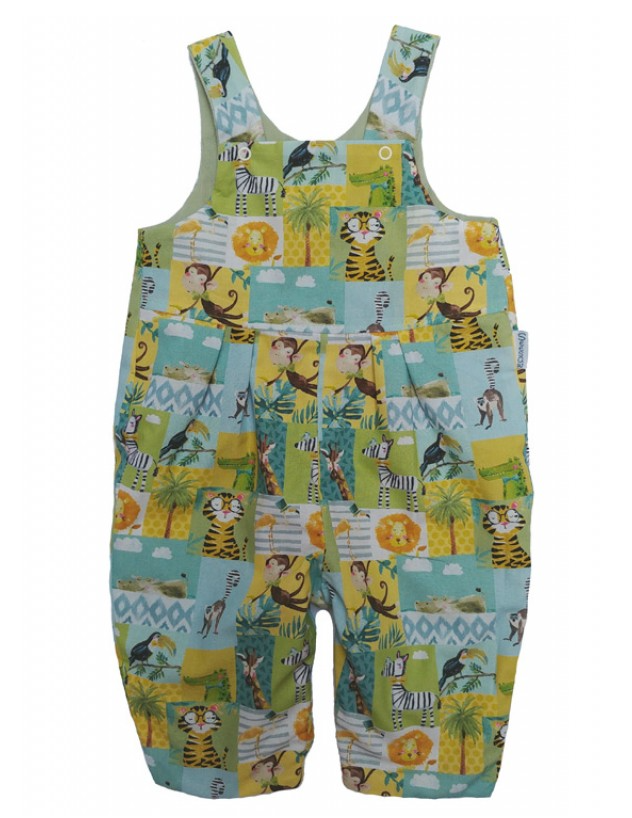 Jolly Jungle Reversible Dungarees by Seesaw, jungle print side shown, vibrant patchwork with lion, tiger, monkey, zebra and toucan on mint and yellow