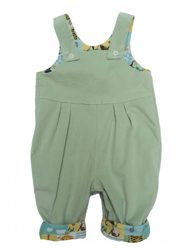 Jolly Jungle Reversible Dungarees by Seesaw, solid sage green side shown, jungle print visible on cuffed hems and straps
