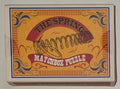 The Spring Matchbox Puzzle by Professor Puzzle — metal coil spring and ring disentanglement brainteaser in matchbox-style box, ages 8+