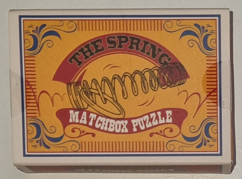The Spring Matchbox Puzzle by Professor Puzzle — metal coil spring and ring disentanglement brainteaser in matchbox-style box, ages 8+