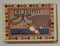 The Trapeze Matchbox Puzzle by Professor Puzzle — metal wire ring disentanglement brainteaser in matchbox-style box, ages 8+