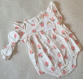 White and cream baby romper with pink strawberry print and matching headband